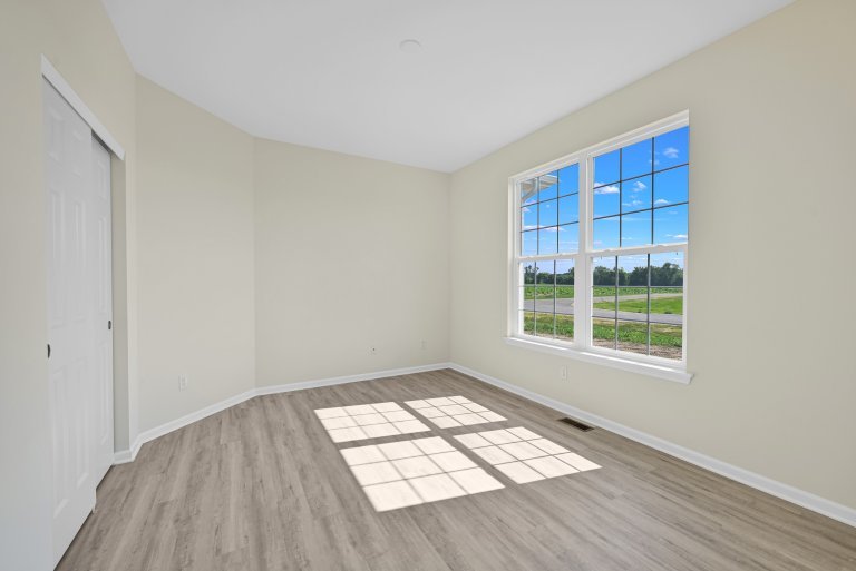 Bonus room in the Gerstad Builders Truman floor plan featuring an open flexible layout and large windows for natural light.