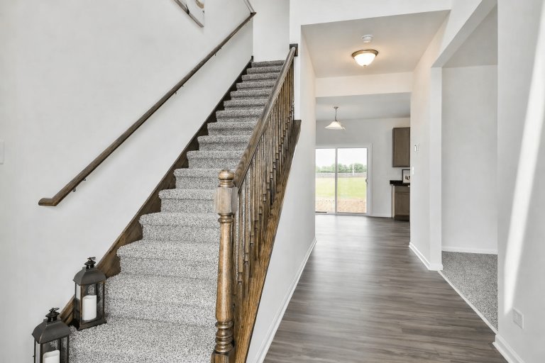 Georgian model entryway features lots of natural light and functional floor plan.