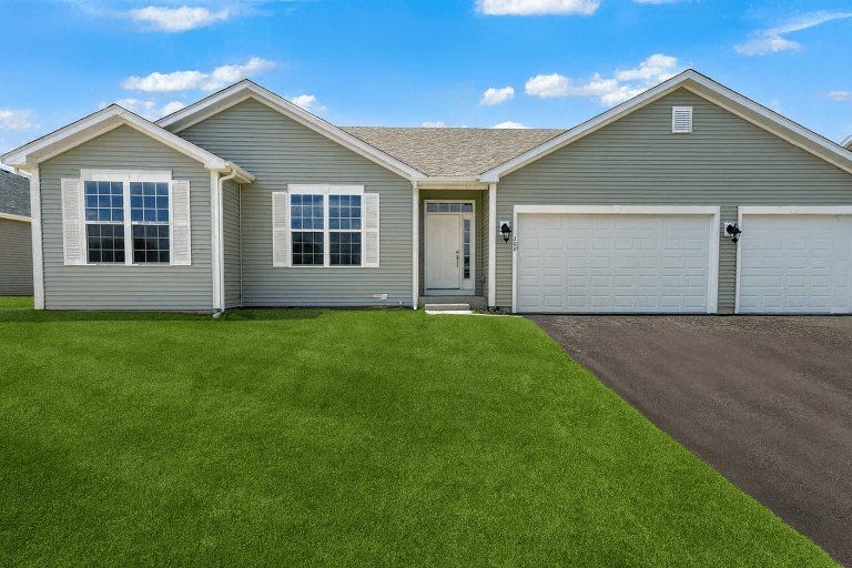 New construction Truman floorplan exterior with three car garage and ranch style living.